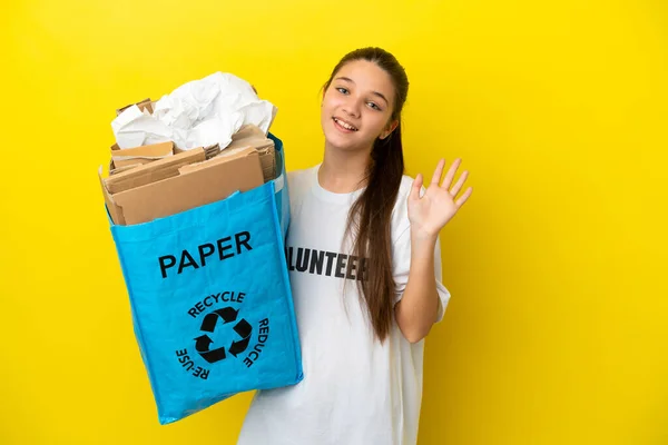 Little Girl Holding Recycling Bag Full Paper Recycle Isolated Yellow — Stock Photo, Image