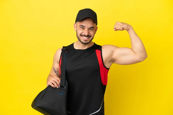 Young Sport Caucasian Man Sport Bag Isolated Yellow Background Doing — Stock Photo, Image