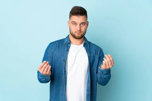 Russian Handsome Man Isolated Blue Background Making Money Gesture Ruined — Stock Fotó