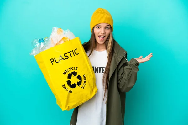 Little Girl Holding Bag Full Plastic Bottles Recycle Isolated Blue — Stock Photo, Image