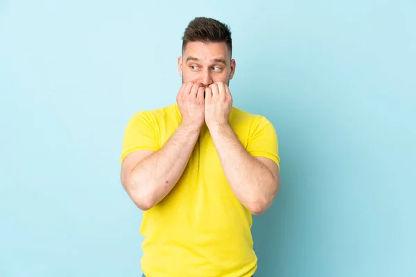 Russian Handsome Man Isolated Blue Background Nervous Scared Putting Hands — kuvapankkivalokuva