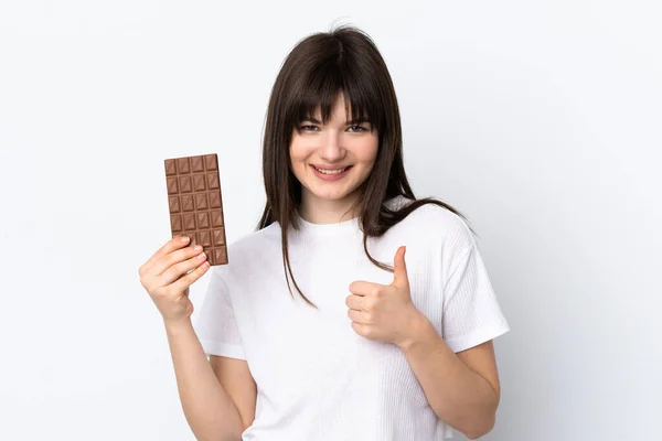 Young Ukrainian Woman Isolated White Background Taking Chocolate Tablet Thumb — Stok Foto