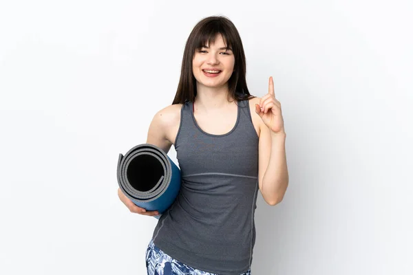 Ukrajinská Sportovní Dívka Rohožkou Izolované Modrém Pozadí Ukazuje Skvělý Nápad — Stock fotografie