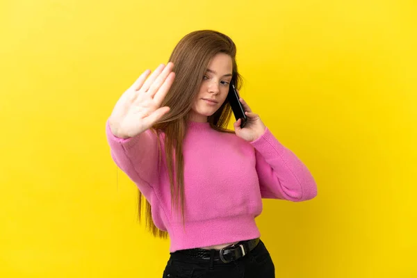 Teenager Girl Using Mobile Phone Isolated Yellow Background Making Stop — Stock Photo, Image