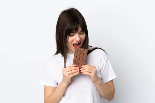 Young Ukrainian Woman Isolated White Background Eating Chocolate Tablet — Stok Foto