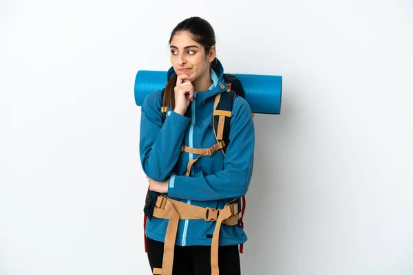 Young Mountaineer Man Big Backpack Isolated Background Having Doubts Thinking — Stock Photo, Image