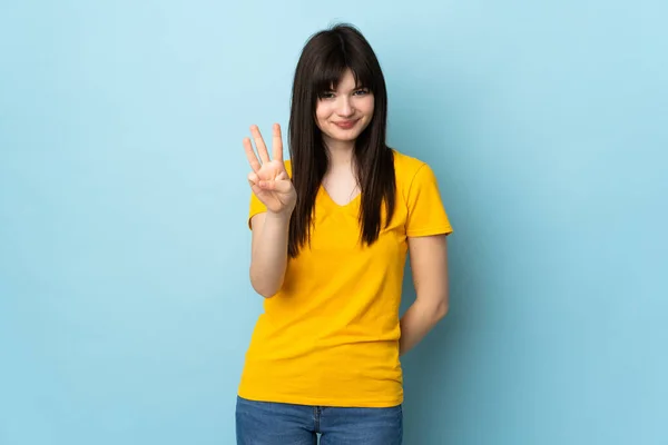 Adolescente Ucraniano Chica Aislado Azul Fondo Feliz Contar Tres Con —  Fotos de Stock