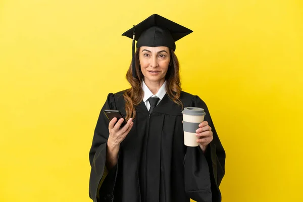 Middle Aged University Graduate Isolated Yellow Background Holding Coffee Take — Stock Photo, Image