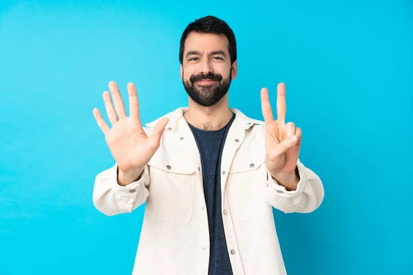 Junger Gutaussehender Mann Mit Weißer Cordjacke Über Isoliertem Blauem Hintergrund — Stockfoto