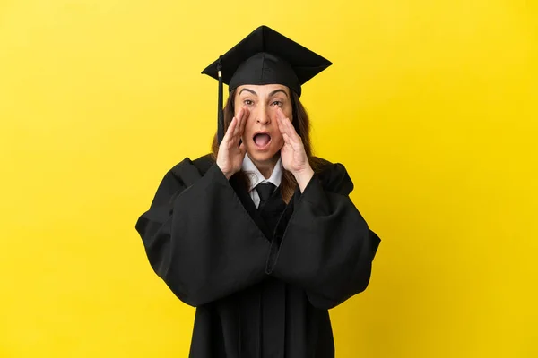 Middle Aged University Graduate Isolated Yellow Background Shouting Announcing Something — Stock Photo, Image