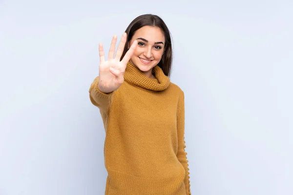 Mavi Arka Planda Izole Edilmiş Genç Beyaz Kadın Mutlu Parmaklarıyla — Stok fotoğraf