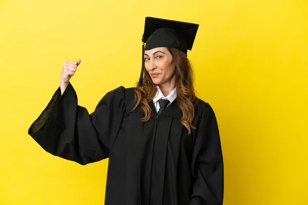 Middle Aged University Graduate Isolated Yellow Background Doing Strong Gesture — Stock Photo, Image