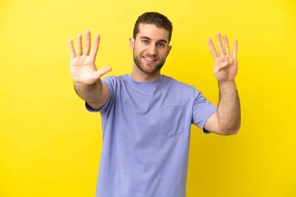 Handsome Blonde Man Isolated Yellow Background Counting Nine Fingers — Stockfoto