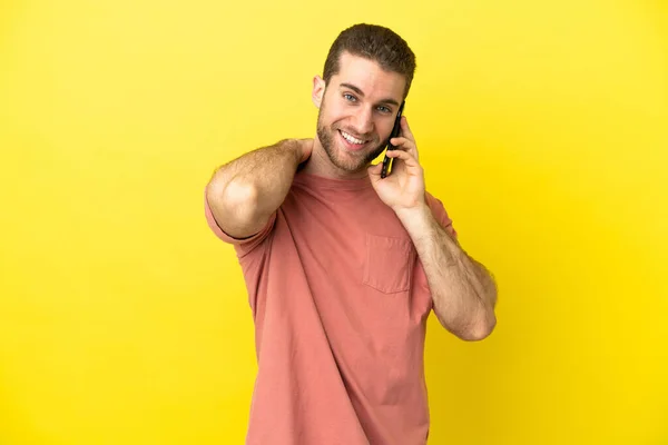 Handsome Blonde Man Using Mobile Phone Isolated Background Laughing — Stock Photo, Image