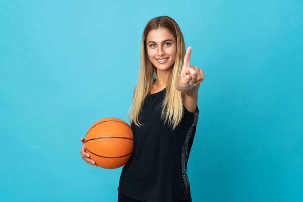 Jovem Mulher Jogando Basquete Isolado Fundo Branco Mostrando Levantando Dedo — Fotografia de Stock