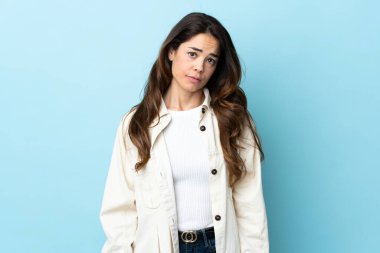 Woman over isolated background with sad expression