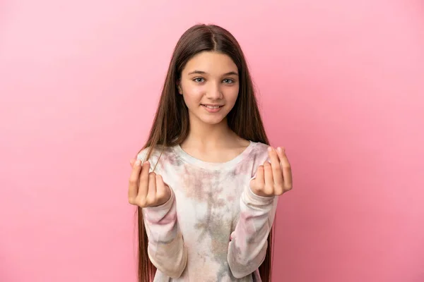 Menina Sobre Fundo Rosa Isolado Fazendo Gesto Dinheiro — Fotografia de Stock