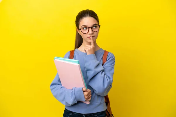 Student Kid Woman Isolated Yellow Background Having Doubts While Looking — Stock Photo, Image