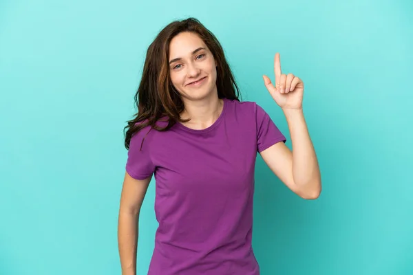 Jonge Blanke Vrouw Geïsoleerd Blauwe Achtergrond Tonen Tillen Een Vinger — Stockfoto