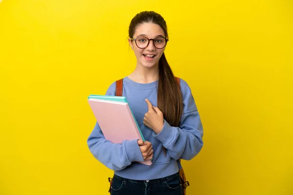 Studentin Kind Frau Über Isolierten Gelben Hintergrund Mit Überraschendem Gesichtsausdruck — Stockfoto