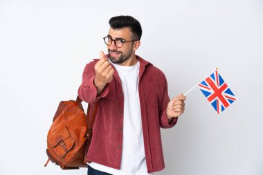 Birleşik Krallık bayrağı tutan İspanyol genç adam para hareketi yapıyor.