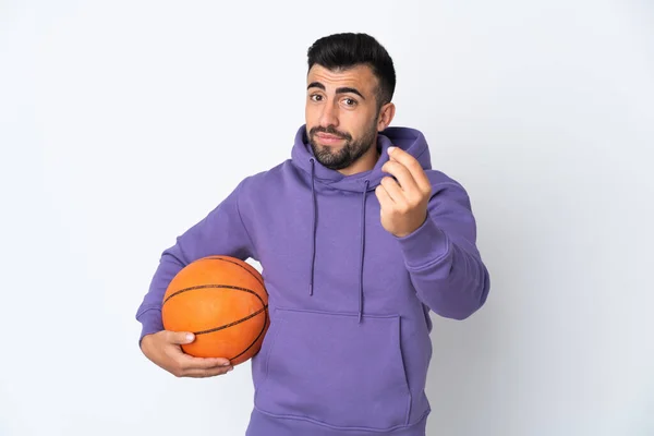 Hombre Jugando Baloncesto Sobre Pared Blanca Aislada Haciendo Gesto Dinero —  Fotos de Stock