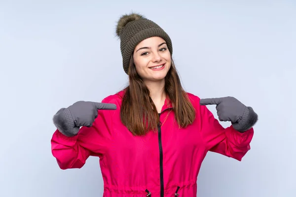 Young Girl Winter Hat Isolated Blue Background Proud Self Satisfied — 图库照片
