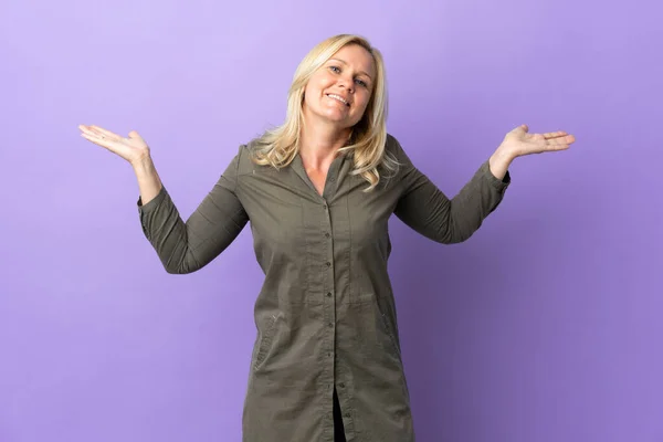 Middle Age Lithuanian Woman Isolated Purple Background Shocked Facial Expression — Zdjęcie stockowe