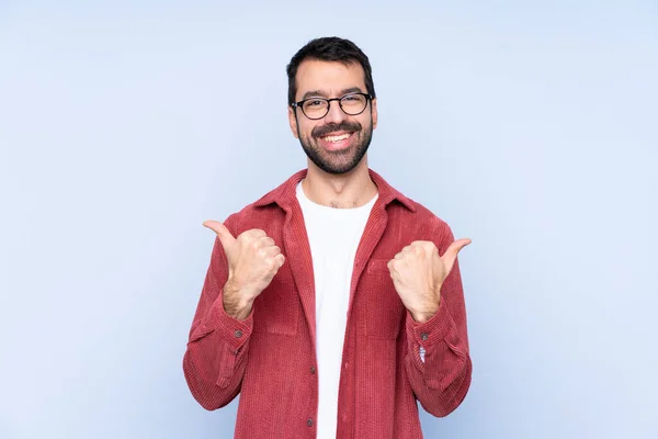 Young Caucasian Man Wearing Corduroy Jacket Blue Background Thumbs Gesture — Stockfoto