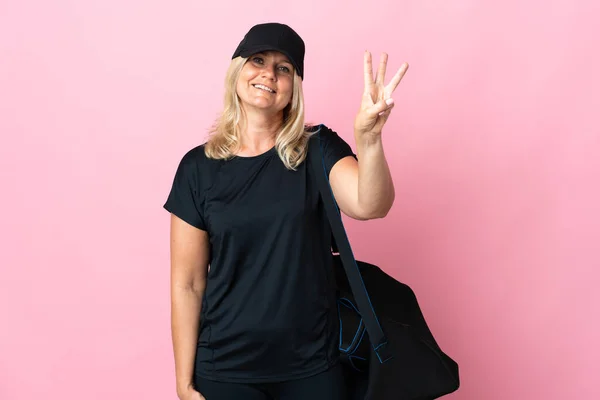 Middle Age Woman Sport Bag Isolated Pink Background Happy Counting — Stock Fotó