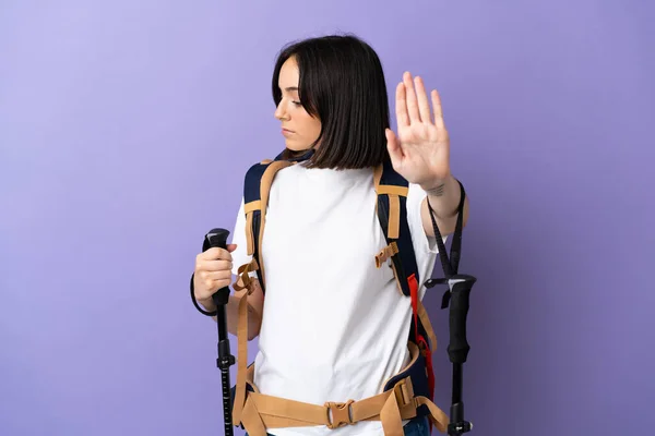 Young Caucasian Woman Backpack Trekking Poles Isolated Blue Background Making — Stock Photo, Image