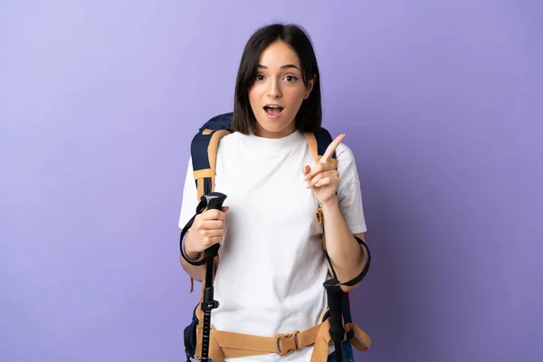 Young Caucasian Woman Backpack Trekking Poles Isolated Blue Background Intending — Stock Photo, Image