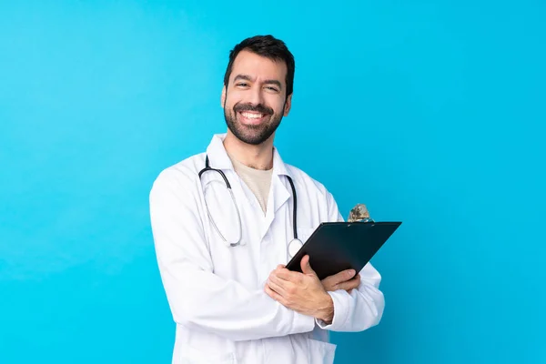 Young Caucasian Man Isolated Background Wearing Doctor Gown Holding Folder — Stock Photo, Image