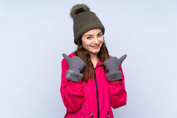 Young Girl Winter Hat Isolated Blue Background Thumbs Gesture Smiling — Fotografia de Stock