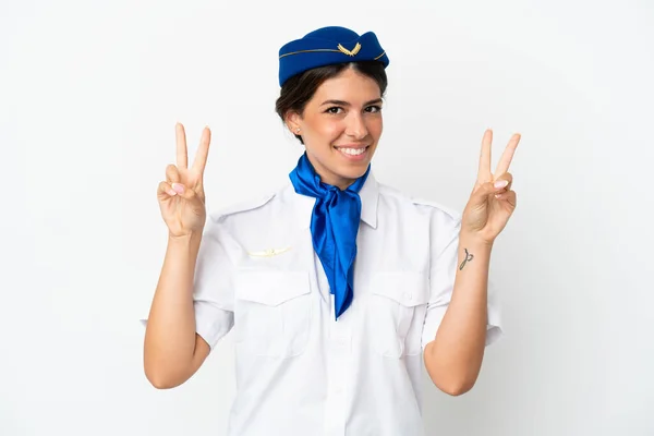 飛行機スチュワーデス原因アジアの女性は両手で勝利のサインを示す白い背景に隔離 — ストック写真