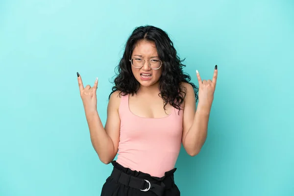 Young Asian Woman Isolated Blue Background Making Horn Gesture — Stock Photo, Image