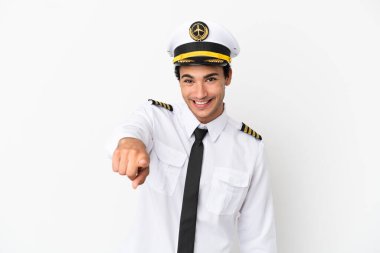 Airplane pilot over isolated white background points finger at you with a confident expression