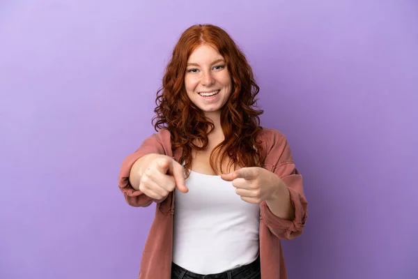 Teenager Redhead Girl Isolated Purple Background Surprised Pointing Front — Stock Photo, Image