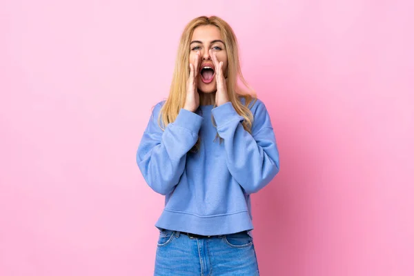 Young Uruguayan Blonde Woman Isolated Pink Background Shouting Announcing Something — Stock Fotó