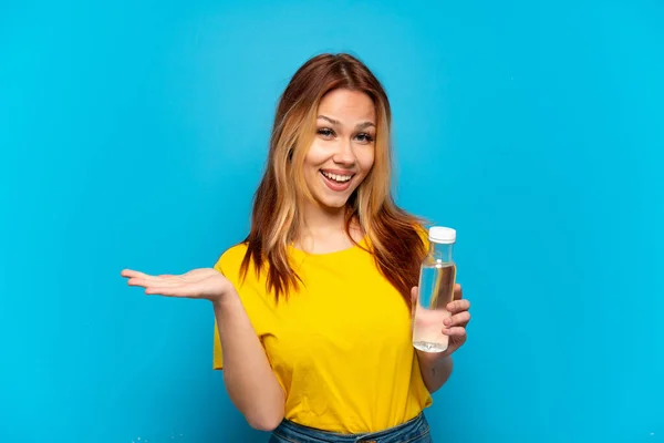 Teenager Girl Bottle Water Isolated Blue Background Shocked Facial Expression — Stock Photo, Image
