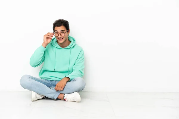 Caucasian Handsome Man Sitting Floor Glasses Surprised — Stok fotoğraf