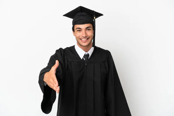 Junge Universitätsabsolventin Vor Isoliertem Weißen Hintergrund Beim Händeschütteln Für Ein — Stockfoto