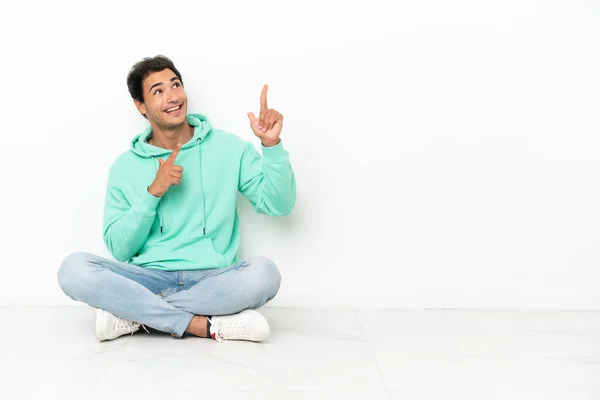 Caucasian Handsome Man Sitting Floor Pointing Index Finger Great Idea — Stok fotoğraf