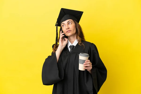 Middle Aged University Graduate Isolated Yellow Background Holding Coffee Take — Stock Photo, Image