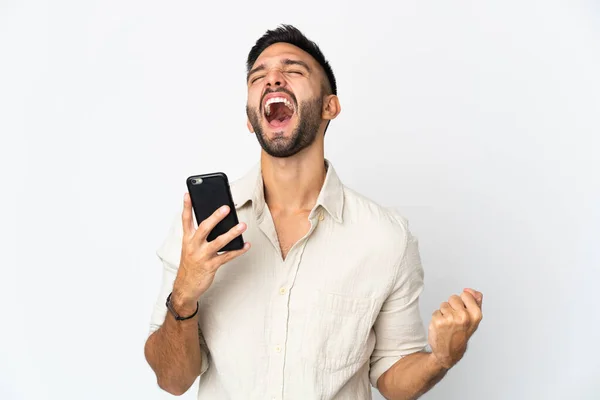 Mladý Běloch Izolovaný Bílém Pozadí Pomocí Mobilního Telefonu Dělá Gesto — Stock fotografie