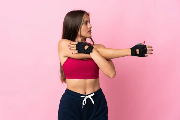 Mujer Uruguaya Joven Aislada Sobre Fondo Rosa Brazo Tensor —  Fotos de Stock