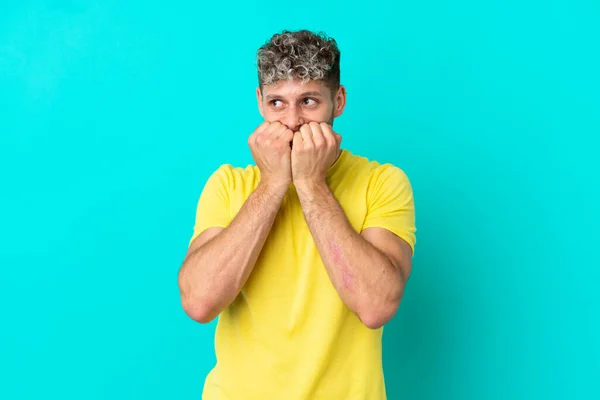 Young Handsome Caucasian Man Isolated Blue Background Nervous Scared Putting — Stock Photo, Image