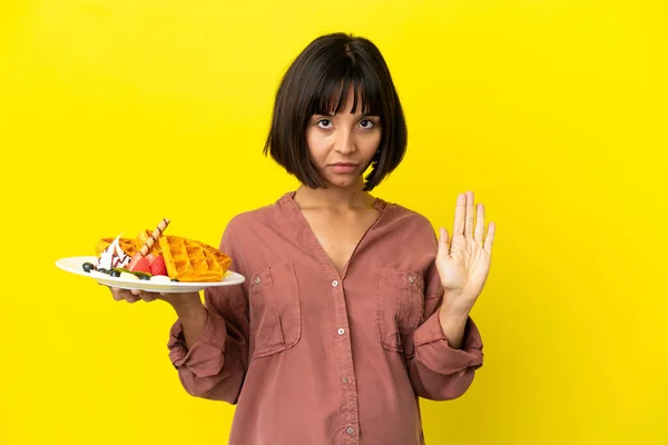 Pregnant Woman Holding Waffles Isolated Yellow Background Making Stop Gesture — Stock Photo, Image