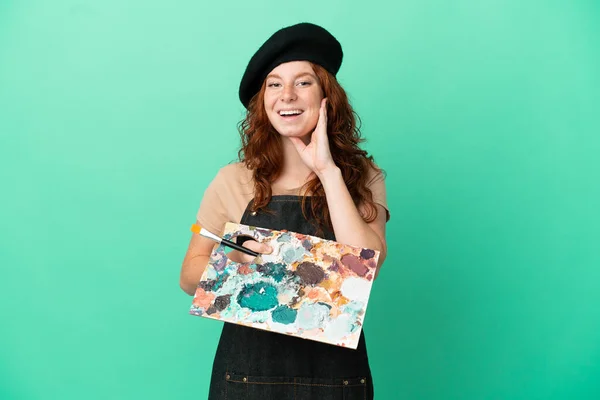 Teenager Redhead Artist Holding Palette Isolated Green Background Surprise Shocked — Stock Photo, Image