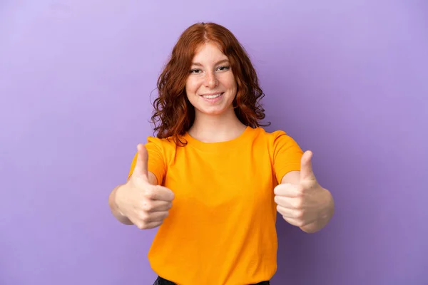 Teenager Redhead Girl Isolated Purple Background Giving Thumbs Gesture — Stock Photo, Image